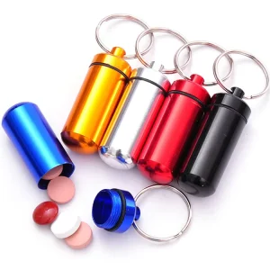 Portable Capsule style Waterproof First Aid Medicine Storage Box Pill Container with Alloy Keychain Custom